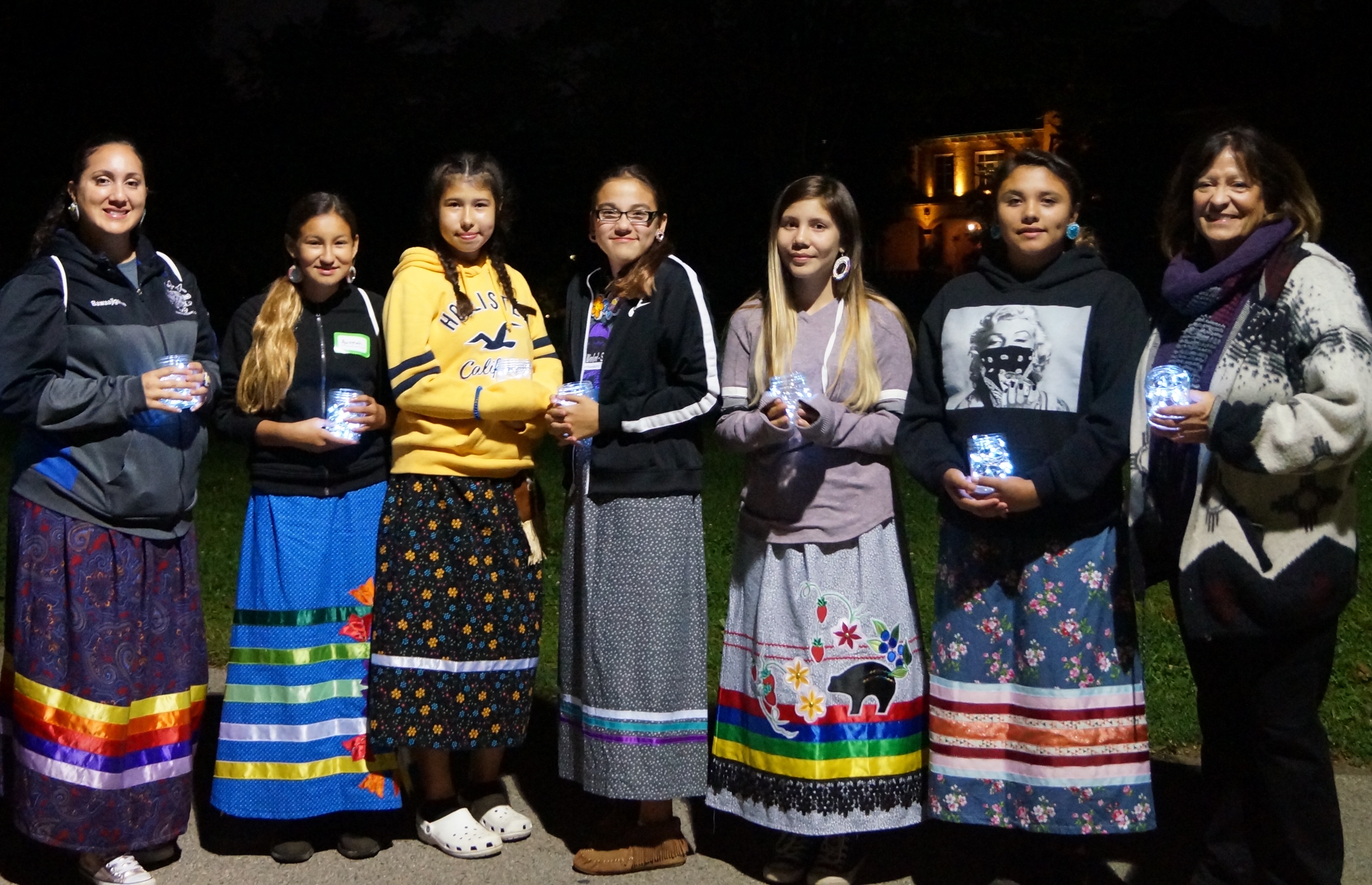 Participants and chaperone (left) with Prof. Patty Loew (right) after the cultural exchange dinner on the Evanston lakefront.